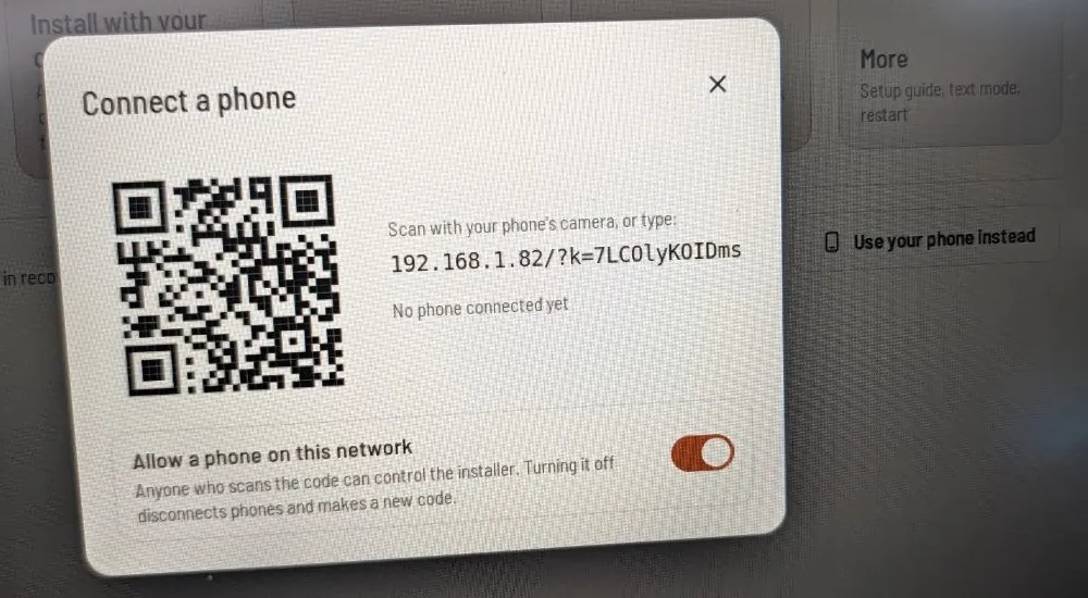 The Connect a phone dialog on the laptop, with a QR code, the address to type (192.168.1.82/?k=…), and the Allow a phone on this network switch turned on.